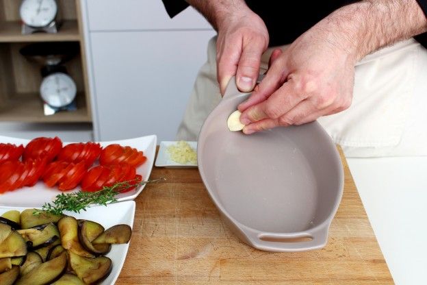 Rub casserole dish with the garlic