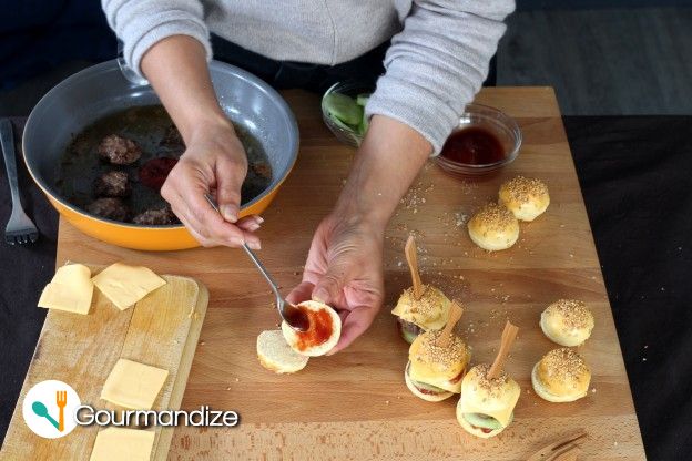 Assemble the burgers: ketchup