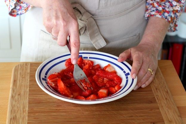 Mash the strawberries