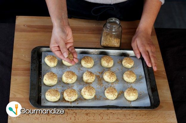 Cover with sesame seeds and bake