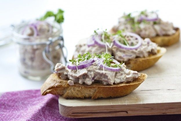 Tuna salad tartines with red onion on toasted whole wheat baguette