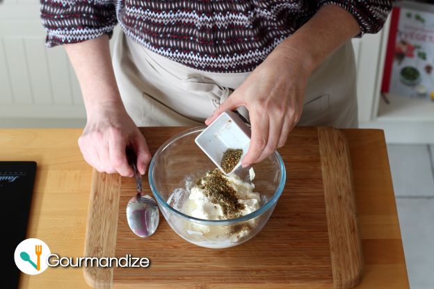 In a bowl, mix the cream cheese, oregano and salt