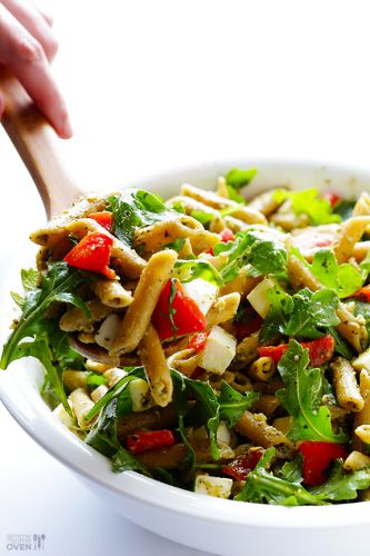 Pasta salad with roasted red peppers, arugula, mozzarella and basil pesto