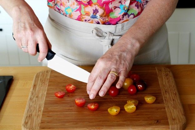 Cut the cherry tomatoes in half