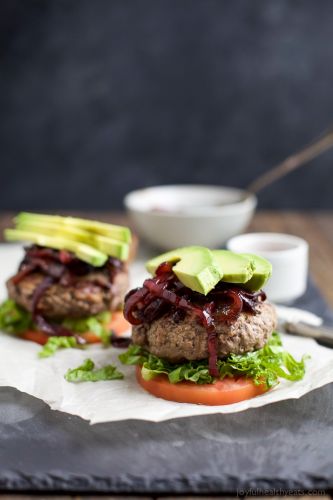 Paleo burgers with avocado and caramelized onions