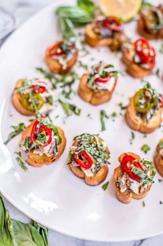 Crostini with Canned Sardines, Sherry Pickled Chiles and Herbs