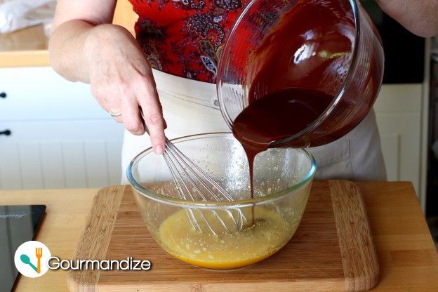 Pour the melted chocolate onto the egg-sugar mixture