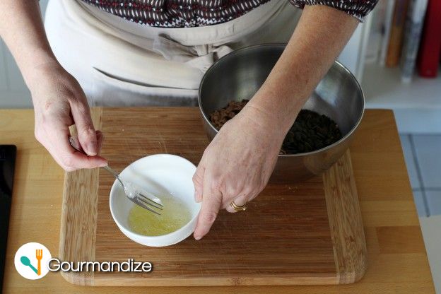 Gently beat the egg white with a fork, then add it to the bowl