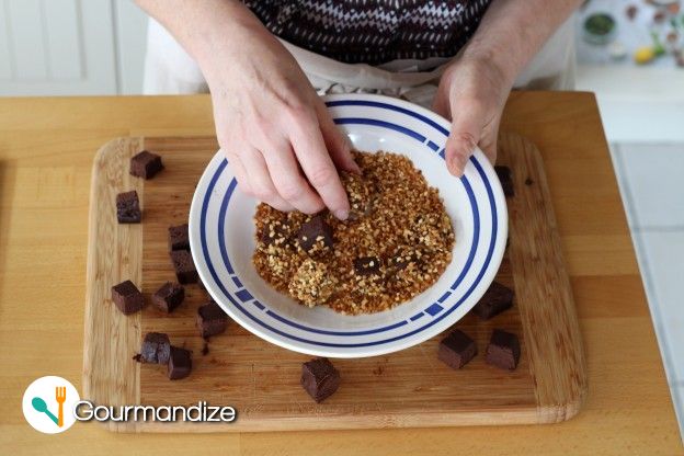 Coat the rest of the cubes in the crushed pralines