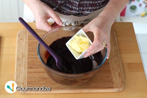 When the mixture is at 100 °F, add the softened butter cut into cubes