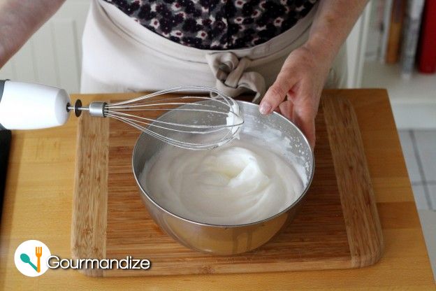 Beat the egg whites into stiff peaks