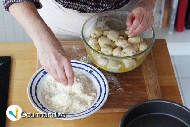 Place the balls into the melted butter, mix well, then coat each ball in the Parmesan