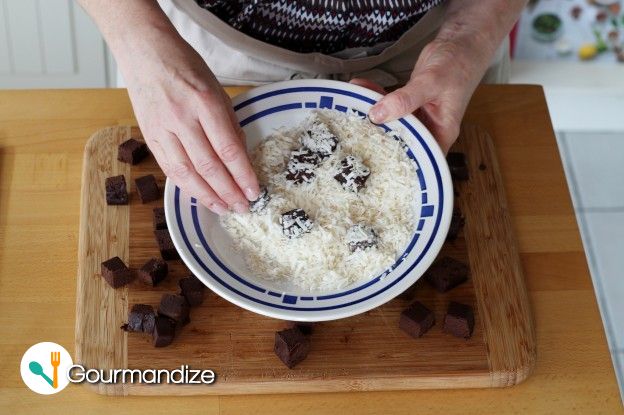 Coat 1/3 of the cubes in the grated coconut