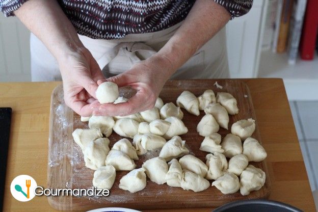 Shape the pieces of dough into 40 balls