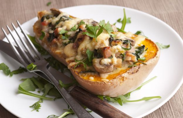 Butternut squash stuffed with bacon, spinach and mushrooms