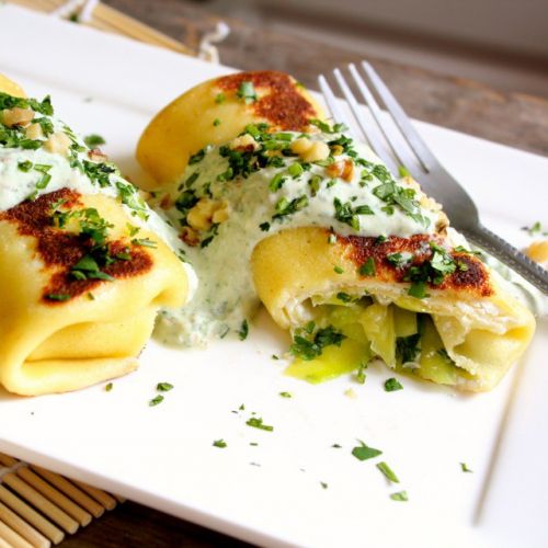 Goat's cheese and zucchini blintzes with cilantro cream sauce