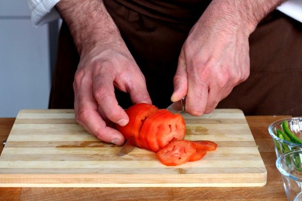 Slice the tomatoes