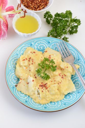 Chicken and cheese ravioli with pumpkin alfredo sauce