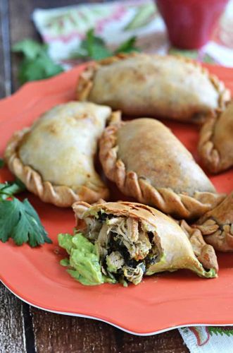 Chicken, spinach and poblano empanadas with avocado jalapeno dip