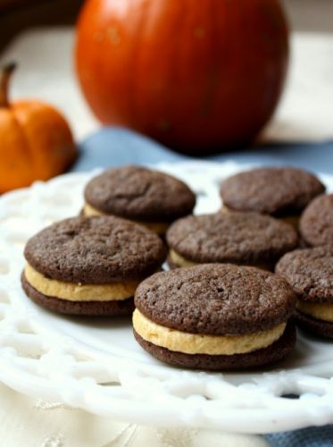 Chocolate sandwich cookies with pumpkin spice buttercream