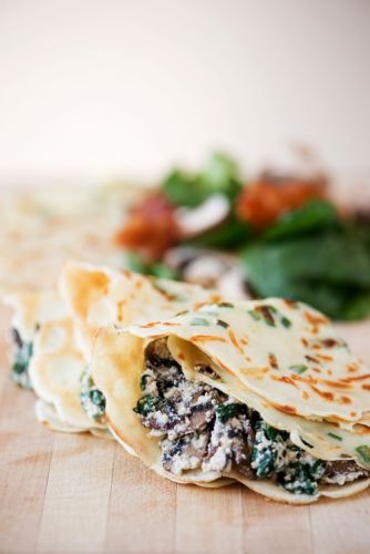 Green onion Parmesan crepes with ricotta, spinach, bacon and mushroom filling