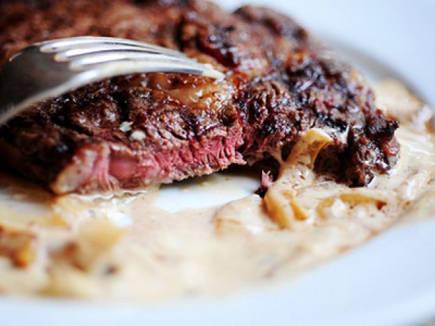 Grilled Ribeye Steak with Onion Blue Cheese Sauce