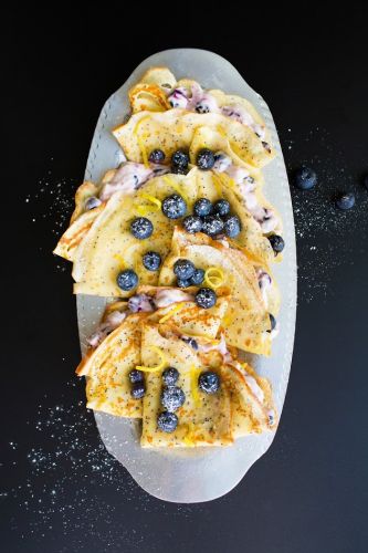 Poppyseed lemon crepes with blueberry cream cheese filling