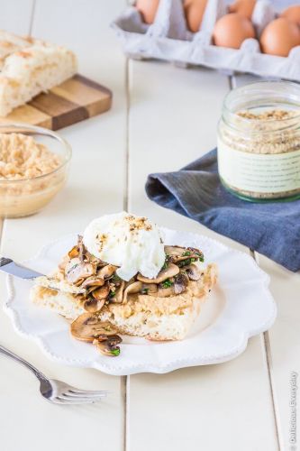 Poached eggs on Turkish toast with mushrooms, hummus and dukkah