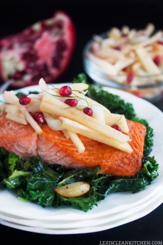 Roasted salmon with apple fennel salad over garlicky kale