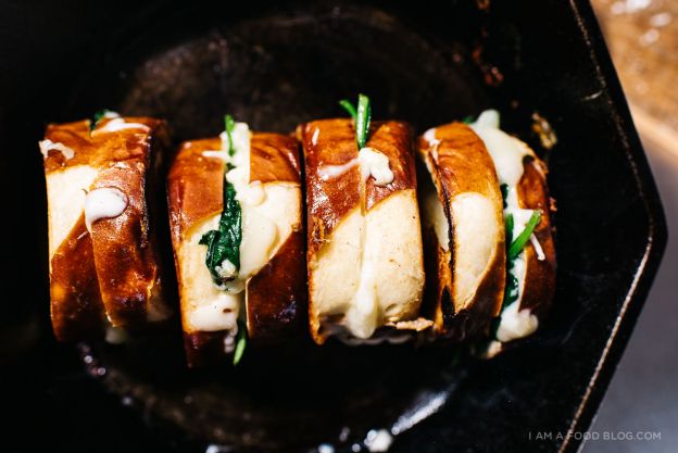 Spinach mozzarella grilled cheese on pretzel bread