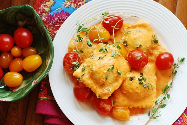 Spinach and ricotta cheese ravioli in tomato cream sauce