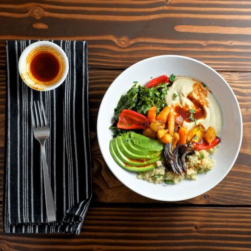 QUINOA POWER BOWL WITH AVOCADO, HUMMUS, AND SMOKED PAPRIKA VINAIGRETTE