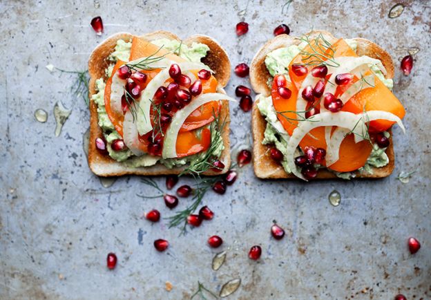 Avocado toast with persimmon pomegranate and fennel