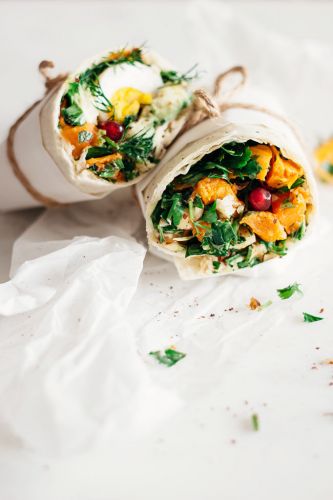 Sweet potato, hummus, greens and egg wrap